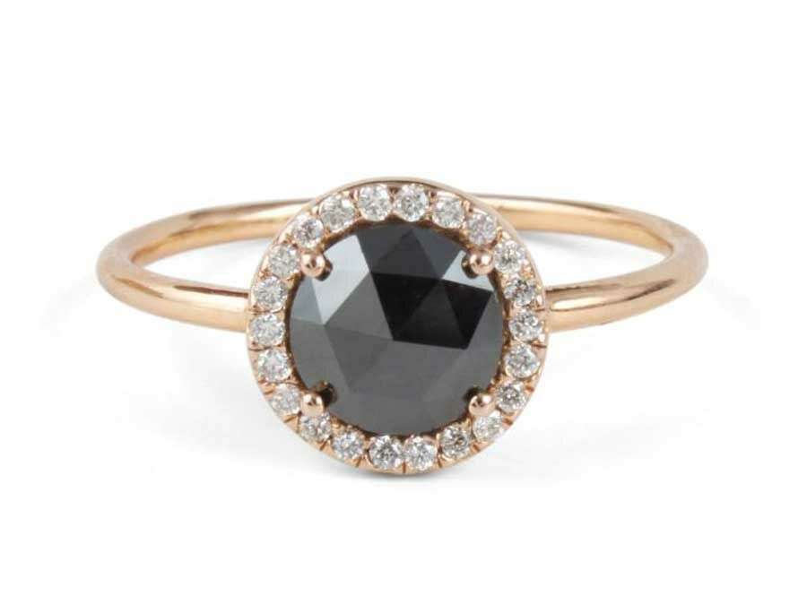 large black diamond in yellow gold