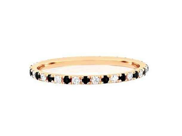 ring with alternating black and white diamonds